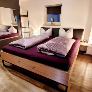 Postel nebo postele na pokoji v ubytování Ferienwohnung Am Hochfeld
