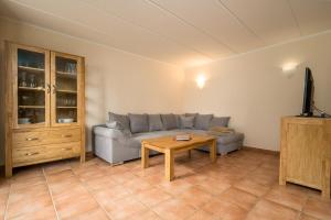 a living room with a couch and a table at Fischerhaus 309 in Rechlin