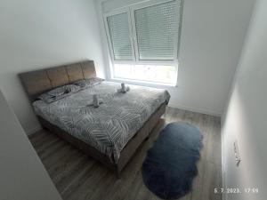 Postel nebo postele na pokoji v ubytování Apartman Deny