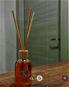 a bottle of honey with sticks sticking out of it at Casa vacanze San Francesco in Barletta