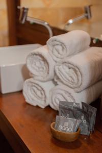 a pile of towels on top of a table at Ventana Hotel in Prea