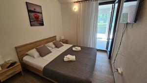 Postel nebo postele na pokoji v ubytování Apartman Hope