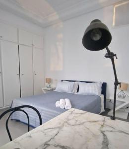Łóżko lub łóżka w pokoju w obiekcie La Maisonnette Turquoise
