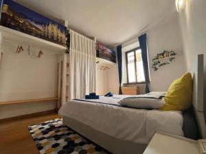 Ένα ή περισσότερα κρεβάτια σε δωμάτιο στο {Porta Venezia - Risorgimento} A/C WiFi