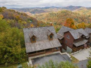 an aerial view of a house with a roof at Firefly Cabin! Hot Tub, Sauna, near Ski Resort in Swiss