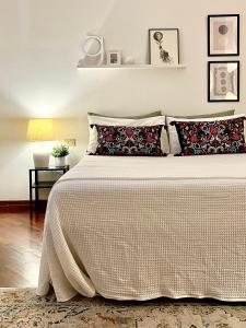 Postel nebo postele na pokoji v ubytování B&B RIO GRANDE