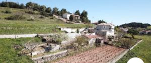 a house on a hill next to a road at Farmhouse in Volímai