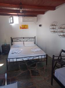 a bedroom with a bed in a room at Aelia Kithnos in Kithnos
