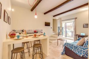 a kitchen and living room with a table and chairs at Vico Street 2 in Naples
