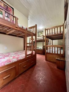a bedroom with two bunk beds in a room at Hostel Manaus ll in Manaus