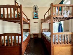 two bunk beds are in a room with at Hostel Manaus ll in Manaus