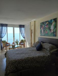 a bedroom with a bed and a view of the ocean at Tahiti Dreams in El Campello +41 photos