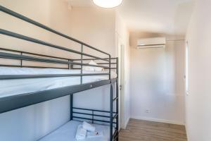 a room with two bunk beds in a building at #164 Saradel 42 by Home Holidays in Albufeira +48 photos