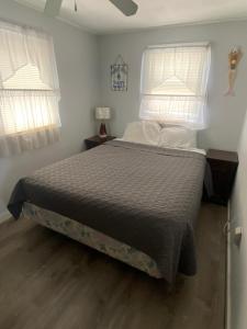 Ένα ή περισσότερα κρεβάτια σε δωμάτιο στο Nautical Beach Properties