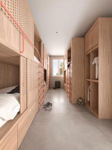 a bedroom with wooden cabinets and a bed at Bloom Hostel Bar & Garden in Bordeaux
