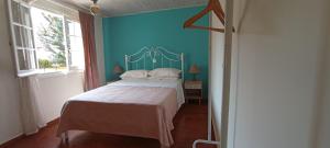 A bed or beds in a room at Sweet Maisonette in Corfu Town
