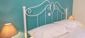 A bed or beds in a room at Sweet Maisonette in Corfu Town