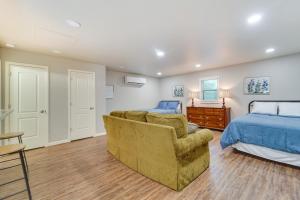 a bedroom with a bed and a couch and a bed at Amarillo Vacation Rental with Shared Pool! in Amarillo