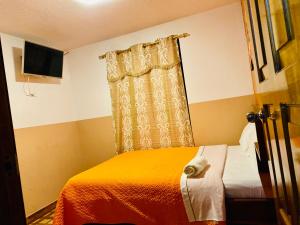 Postel nebo postele na pokoji v ubytování Hostal Alpachaca - New Quito Airport