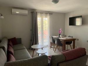 a living room with a couch and a table at Arian Apartments in Argostoli