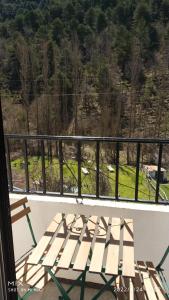 a white bench sitting on a balcony with a view at La María de Tortas in Paterna del Madera