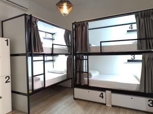 a room with three bunk beds in it at Way Hostel Madrid in Madrid