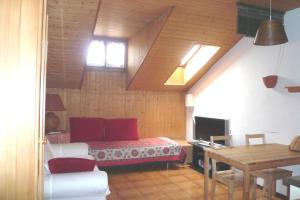 a bedroom with a bed and a desk and a table at Casa Jolanda in Bellinzona