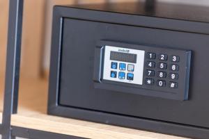 a microwave oven sitting on top of a shelf at Le Gemme di Cavour Luxury Rooms in Palermo