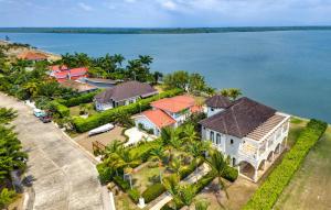 an aerial view of a house on the water at Villa Castello- Water Views & Resort Amenities in Placencia