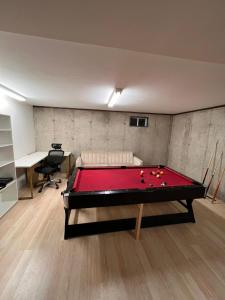 a room with a pool table in a room at Single family Home ONLY long term booking of 28 days or longer in Boston