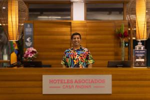 a man standing behind a counter in a store at Tucan Suites Tarapoto - Hotel Asociado Casa Andina in Tarapoto +83 photos