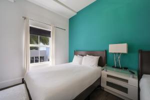 Cama o camas de una habitación en Ithaca of South Beach Hotel