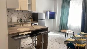 a small kitchen with a counter and a table at Del Mar 1C - New Beach First floor One bed flat in Puerto de Sagunto