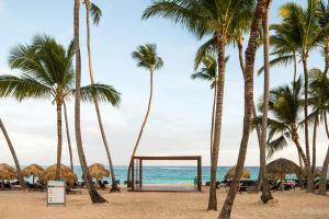 a view of the beach with palm trees at Royalton Hideaway Punta Cana, An Autograph Collection All-Inclusive Resort & Casino - Adults Only in Punta Cana