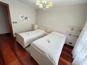 BAKIO BIDEA BOUTIQUE tesisinde bir odada yatak veya yataklar