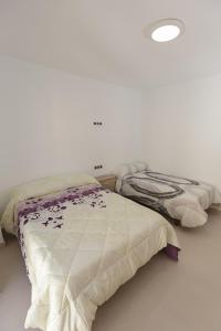 Ένα ή περισσότερα κρεβάτια σε δωμάτιο στο apartamentos El-Hizan