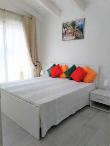 En eller flere senger på et rom på Affittimoderni Viddalba Sporting - VISPO07