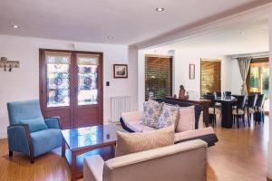 a living room with a couch and a table at Casa de Campo in La Falda