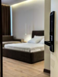 Postel nebo postele na pokoji v ubytování ALEXANDER Rooms