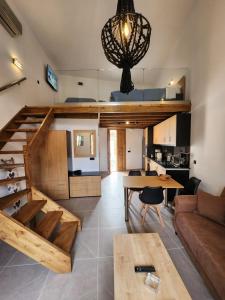 a living room and kitchen with a loft at Kastello in Meyisti