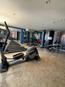 a gym with treadmills and elliptical machines at Gran Recreo Hotel - Trujillo - Perú in Trujillo