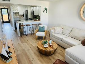 a living room with a couch and a table at Paradise at Moon Bay in Key Largo