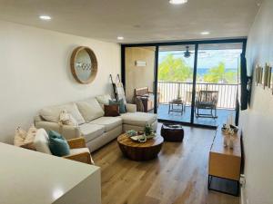 a living room with a couch and a table at Paradise at Moon Bay in Key Largo