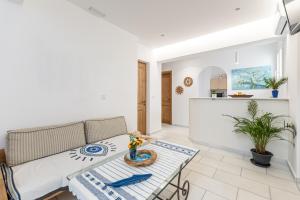 Kuchyň nebo kuchyňský kout v ubytování Galazia Boutique Apartments