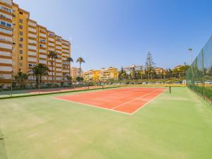 a tennis court in the middle of a city at Cubo's Estudio Centro Internacional in Caleta De Velez