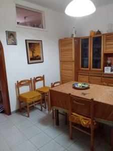 a kitchen with a table and chairs in a room at Casa della Nonna in Pizzo