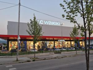 a store with a sign on the side of a building at Esperanto in Vranje