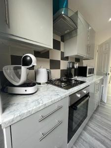 a kitchen with a counter with a mixer on it at Beautiful house/Parking in Plumstead