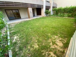 an empty yard in front of a building at Marassi Marina Residences in El Alamein