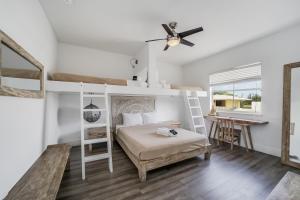 a bedroom with a bunk bed and a desk at Treehouse Studio Hotel in Miami